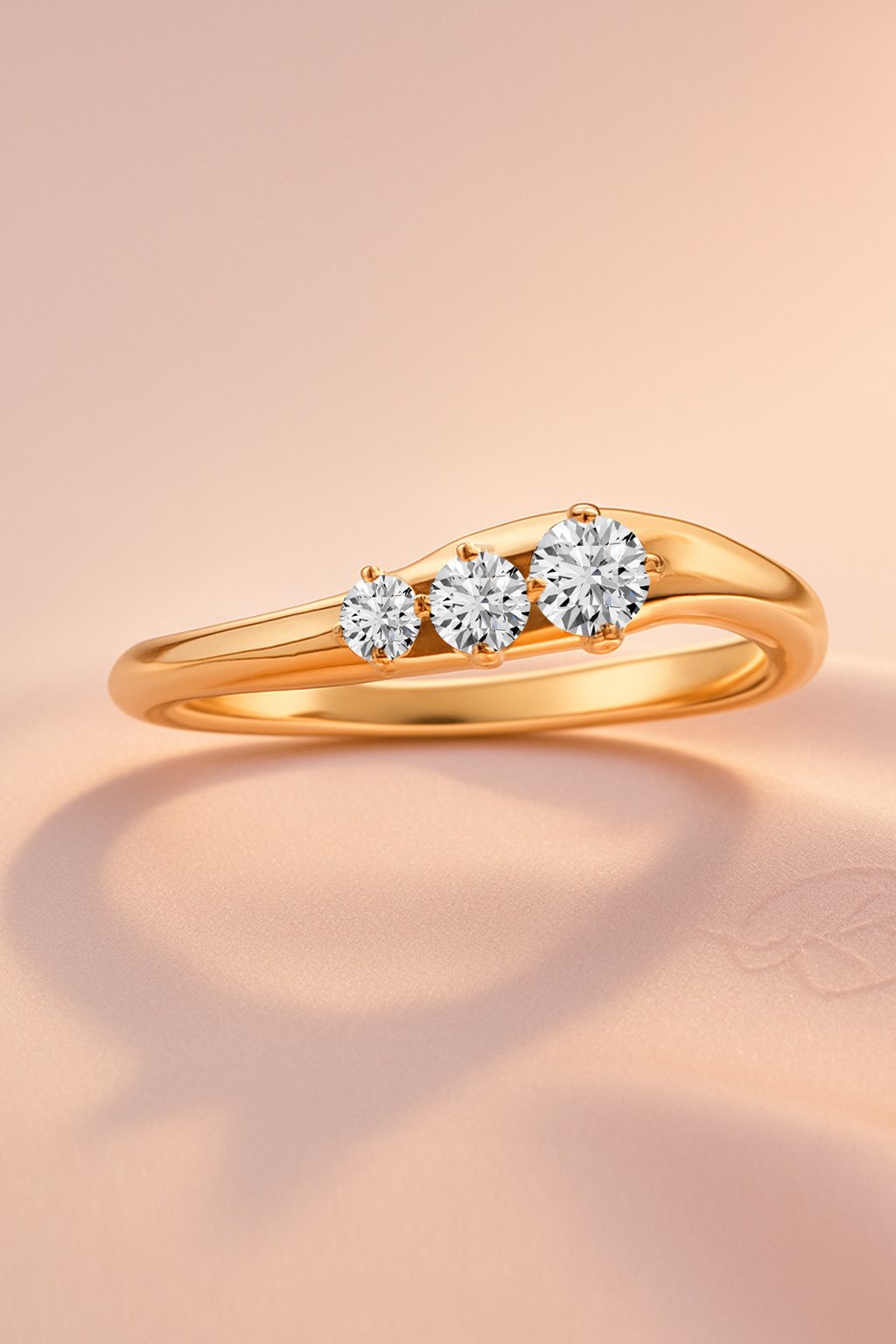 Crescendo graduated three-stone diamond ring in gold finish